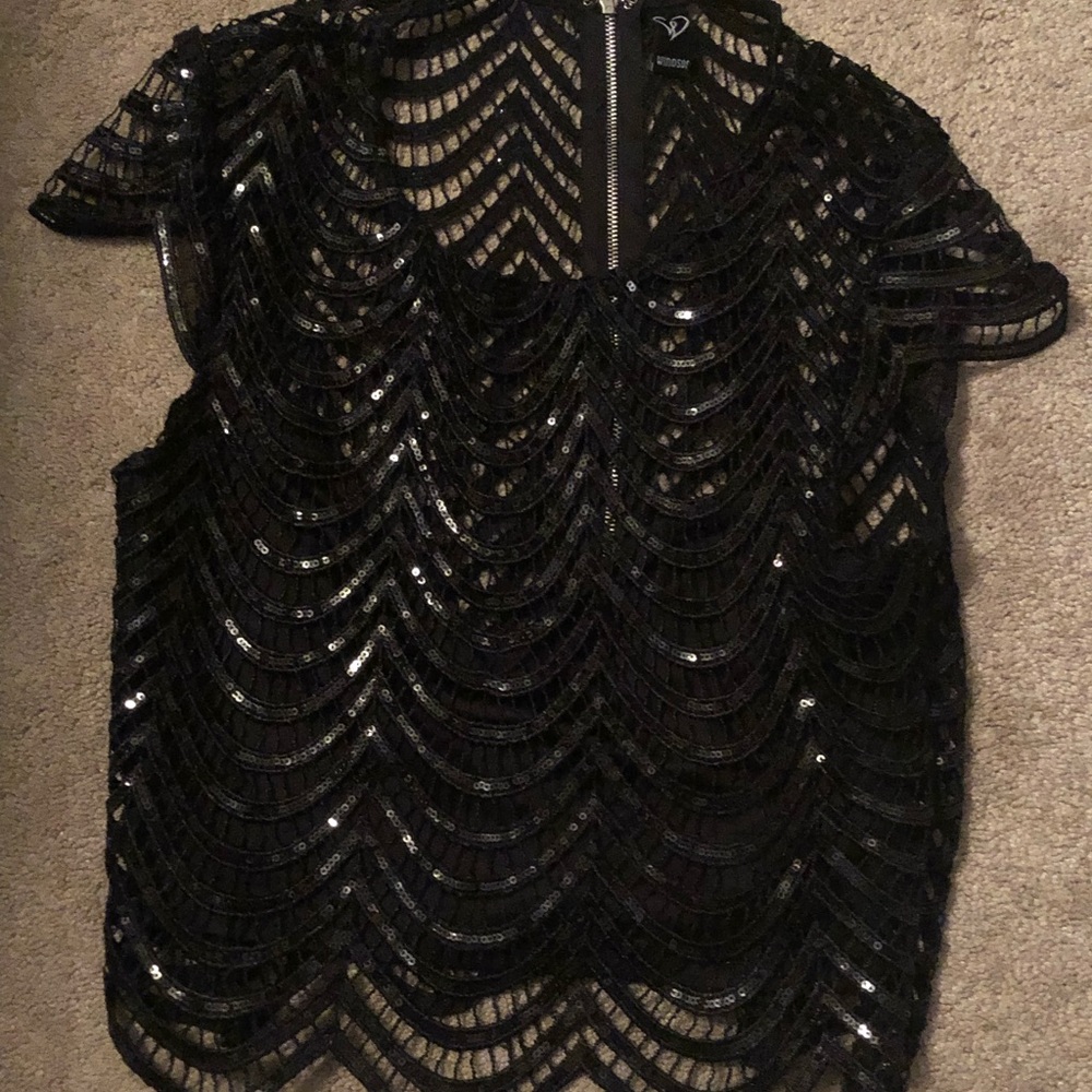 This statement piece is a size Small . Good for layering